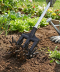Lightweight Rotary Cultivator Tiller with Adjustable Stainless Steel Poles tilling soil in a garden, no heavy lifting needed.