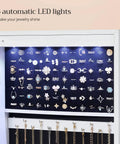 Image of Straight Up Premium Wall Or Door Mounted Jewelry Cabinet With Full Length Mirror showing six LED lights illuminating organized rings and necklaces.