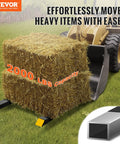 Heavy Duty Clamp On Pallet Forks 2000 Lb Capacity 60 Inch Total Length With Adjustable Stabilizer Bar attached to tractor lifting hay bale
