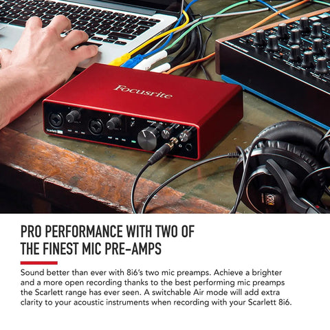 Scarlett 8i6 Third Gen USB Audio Interface For Recording, Songwriting, And Streaming on desk with cables and headphones