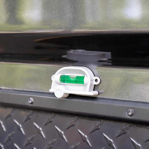 Retro RV Leveling Pack with side to side on point precision mounted with screws on metal surface, vintage camper design visible.