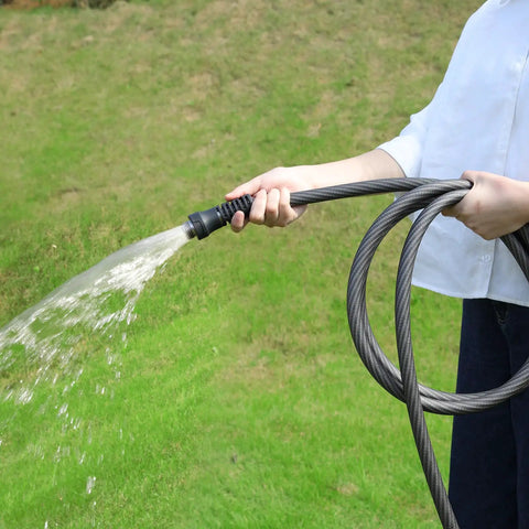 Heavy Duty 50 Foot Braided Garden Hose With Lightweight Flexible Design Kink Resistant And Tangle Free Leak Free Connections Swivel Handle Male To Female Fittings Triple Layer Hybrid Material Durable Grey in use on lawn