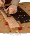 Using plane on wood block with 32 Piece Workholding Kit With Dog And Wedge Clamp Holdfast System For MFT Tables.