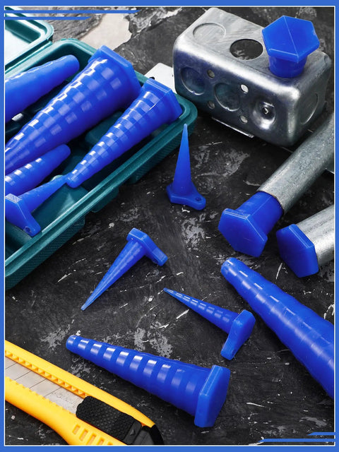 Blue 42 Piece Hydraulic Oil Service Plug Kit With Large Medium And Small Plugs arranged on a dark surface with tools