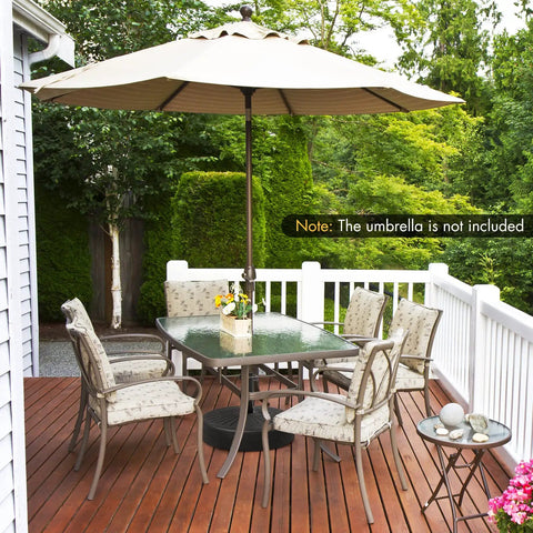Patio setting with Beefy Fillable Umbrella Base Stand, 80 Lb Heavy Duty HDPE Weighted With Water Or Sand, holding an umbrella, not included.