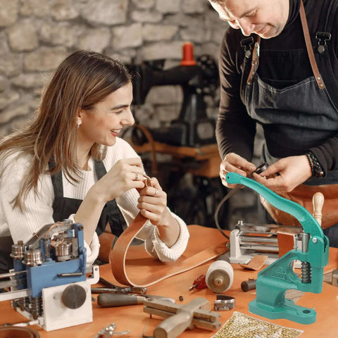 Workshop with Heavy Duty Hand Press Grommet Kit With Punch Tool and Rubber Hammer, artisans working on leather projects