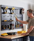 Heavy Duty Metal Pegboard Panels Four Pack With Fifty Hooks For Garage Workshop Office Or Craft Room Rust Resistant Steel Wall Organizer 16 By 12 Inches Tough As Nails Tool Storage For Workbench And More installed on wall holding tools