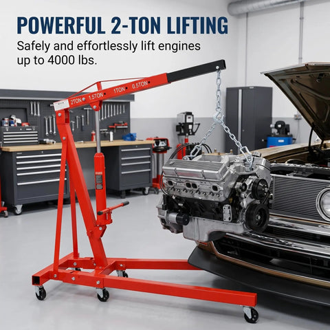 Hella Solid Heavy Duty Folding Engine Hoist And Portable Cherry Picker Shop Crane With Adjustable Boom lifting an engine in a garage.