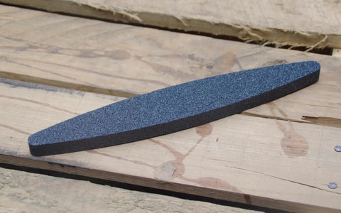 Ultra Coarse Manticore Scythe Sharpening Stone For Axes Machetes And Tools, Fast Pro Grade 260 Micron Grit on wooden surface