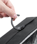 Hand holding hook of Small Wash Pouch Travel Toiletry Bag Weatherproof With Upright Or Hanging Design, Wide UltraZip Opening shown