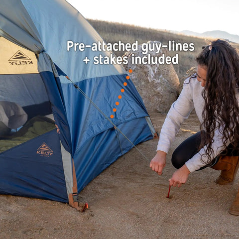 Securing Late Start 2P Backpacking Tent for Two People with stakes in outdoor setting