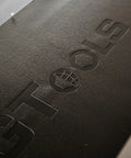Close-up of logo embossed on the top tray of Heavy Duty Steel Rolling Tool Chest With Fourteen Deep Full Extension Drawers And Massive Mega Top Tray.