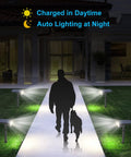 Motion Sensor Solar Powered Outdoor Flood Lights No Fuss 2 Pack With 3 Modes IP67 illuminating a pathway at night