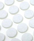 Self Adhesive Three Eighths Inch Felt Furniture Pads Pack Of Seventy Five White Sliders shown in rows on a flat surface