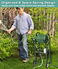 Man using Heavy Duty Garden Hose Reel Cart With Wheels Keeps Your Hose Neat And Ready Holds Up To One Hundred Twenty Five Feet Of Five Eighth Inch Hose Plus A Three Point Nine Foot Leader Hose And Basket Powder Coated Steel Water Winder For Backyard Yard And Lawn in garden