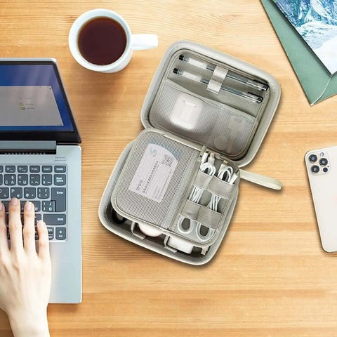 Hard Shell Cable Tech Organizer Travel Case For Power Banks And Portable Chargers With Straight Up Cable Organization And Kickass Gadget Protection Optimized To Keep Essentials Snug And Secure On Every Trip White opened with tech gear on a wooden desk.
