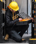 Heavy Duty Steel Parts Organizer Storage Cabinet With Eight Rolling Carry Trays For Mechanics And Crew Chiefs Seeking Tough As Nails Garage Setup That Saves You Major Sweat On Busy Days in a van with a worker using a tray.