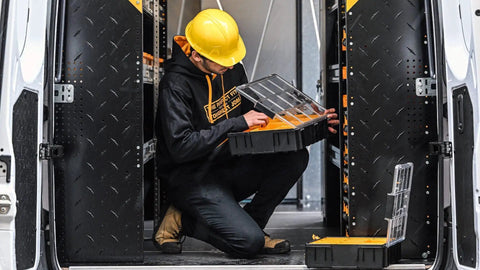 Heavy Duty Steel Parts Organizer Storage Cabinet With Eight Rolling Carry Trays For Mechanics And Crew Chiefs Seeking Tough As Nails Garage Setup That Saves You Major Sweat On Busy Days in a van with a worker using a tray.