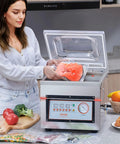 Person using Chamber Vacuum Sealer 320W Power For Wet Foods And Meats Vacuum Packing Machine For Marinades And More Compact 12.6 Inch