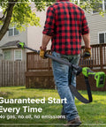 Man using Heavy Duty 24V Brushless Cordless Pole Saw With Eight Inch Guide Bar in backyard for pruning branches.