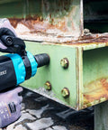 Tough As Nails Twin Turbo Air Impact Wrench With Compact Low Vibration Grip For Tightly Packed Engine Bays And Heavy Duty Truck Maintenance That Powers Through Stubborn Studs Without Breaking A Sweat in use on rusty metal bolts.