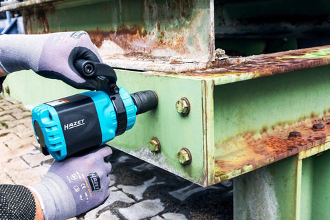 Tough As Nails Twin Turbo Air Impact Wrench With Compact Low Vibration Grip For Tightly Packed Engine Bays And Heavy Duty Truck Maintenance That Powers Through Stubborn Studs Without Breaking A Sweat in use on rusty metal bolts.
