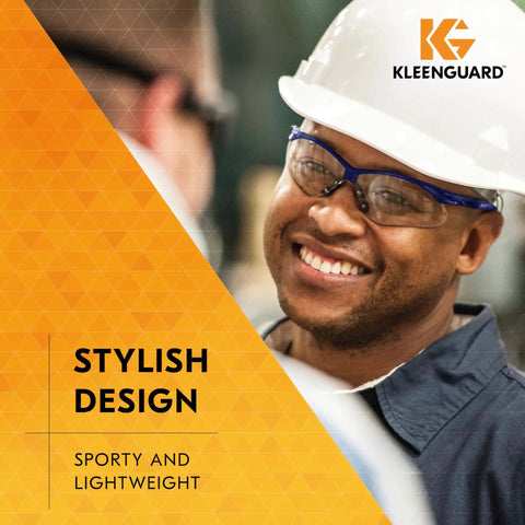 Antifog Safety Glasses Built For The Daily Grind Full Case Bulk Pack With Crystal Clear Lenses And Flexible Metallic Blue Frames For Rock Solid Job Site Reliability worn by a smiling worker in a safety helmet.