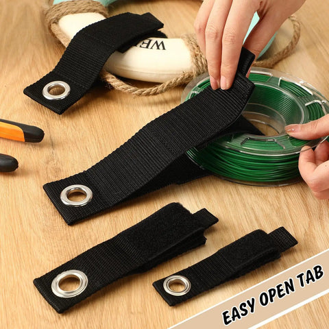 48-Piece Heavy Duty Extension Cord Organizer Set featuring nylon fabric and metal grommet for cable management on wooden surface.