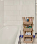 Four Piece Tan Plastic Stackable Storage Bins Open Front Closet Organizer Boxes 28 Inch Tall next to a bathtub
