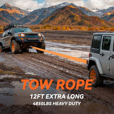 Two off-road vehicles using a 12ft extra long, 4850lbs heavy duty tow rope on muddy terrain with mountains in the background.