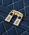 Gold zippers on navy quilted polyester of Queensbury 4 Piece Luggage Set Navy Expandable Spinner Suitcases With Lightweight Aluminum Handles.