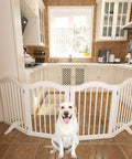 Rock Solid Freestanding Pet Gate With Quick Rollout Four Panel Dog Safety Fence Heavy Duty Crafted Barriers For Roomy Doorways And Stairwells No Sweat Assembly In Crisp White, shown in a kitchen with a dog.