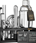 Ultimate Home Bar Mixology Kit With Stand 15 Piece Silver Bar Tool Set displayed on a dark wood stand