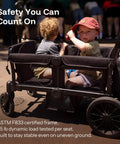 All-Terrain Wagon Stroller For Two Kids Kid-Friendly Foldable Outdoor Beach Wagon with children seated, ASTM certified, black.