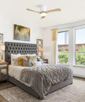 42" Low Profile Ceiling Fan with Light, Matte White Wood Blade Flush Mount Fan in modern bedroom with grey furnishings.