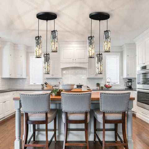 Three Light Black Pendant Light With Crystal Accents, Adjustable Pendant Fixture for Kitchen Island over white cabinets.