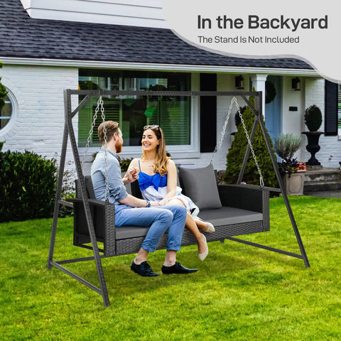 5 Foot Outdoor Porch Swing For Adults Wicker 3 Person Patio Swing With Cushions and Pillow in backyard with two people.