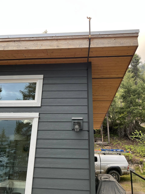Wildfire Protection Sprinkler System With Bracket And Hardware, Includes 25 Ft Fire Resistant Hose installed on house eave