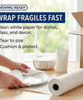 Person wrapping dishes with Bulk Packing Paper Roll 18 Inch By 1400 Feet White Newsprint For Moving, Shipping And Storage.