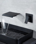 Slick Matte Black Wall Mount Waterfall Bathroom Faucet In Wall Sink Faucet Single Handle showing flowing water into sink