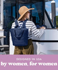 Woman on boat wearing Insulated Leakproof Cooler Backpack For Women Soft 12 Can Lunch Tote Lightweight Beach Picnic Bag Travel Ready Navy