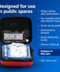 Front view of Philips HeartStart OnSite AED defibrillator in a red slim carry case with blue unit.