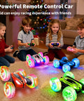Children playing with Four Pack Remote Control Cars For Kids Two Point Four GHz RC Stunt Cars With Wheel Lights indoors