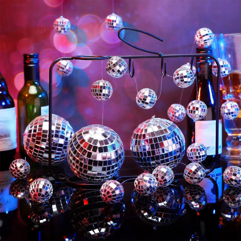 8 Pack Mini Disco Ball Garlands Silver Mirror Balls Hanging Banner displayed with bottles in party decor setting.