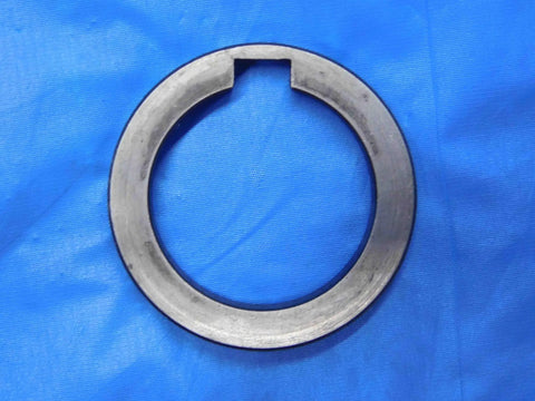 Top Shelf Bulk Lot Of Eight Precision Milling Machine Arbor Spacers For Your Shop Rig One Inch To One Nine Sixteenths Inside Diameter Tooling Accessories, steel spacer on blue background.