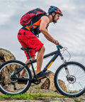 Cyclist on a mountain bike with lightweight aluminum front fork for mountain bikes with air suspension 26 inch for trail rides.