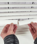 Easy DIY Slick Fix For Cracked Horizontal Blinds Clear Mini Slat Repair Kit With String Holes And Solid Tabs Restores Window Coverings Instantly with hands applying repair tabs.