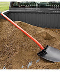 Heavy Duty All Steel Round Point Shovel With 48 Inch Tubular Alloy Handle One Piece Welded Construction Thick 12 Gauge Blade 8.75 By 11.75 Inches Built For Tough Yard Work And Digging Tasks resting in a truck bed filled with soil.
