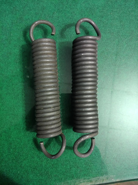 Pro Grade Heavy Duty Extension Springs Eleven Inch Hook To Hook By 1.94 Inch Outside Diameter on green background.
