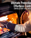 Person using Heat Resistant Fireplace Gloves 14 Inch Fireproof Leather For Fireplace Fire Pit Wood Stove Campfire BBQ Grill Welding Oven Use Tough All Around Grip Ready Heat Shield Gear For Men Gift to load wood into a fire.